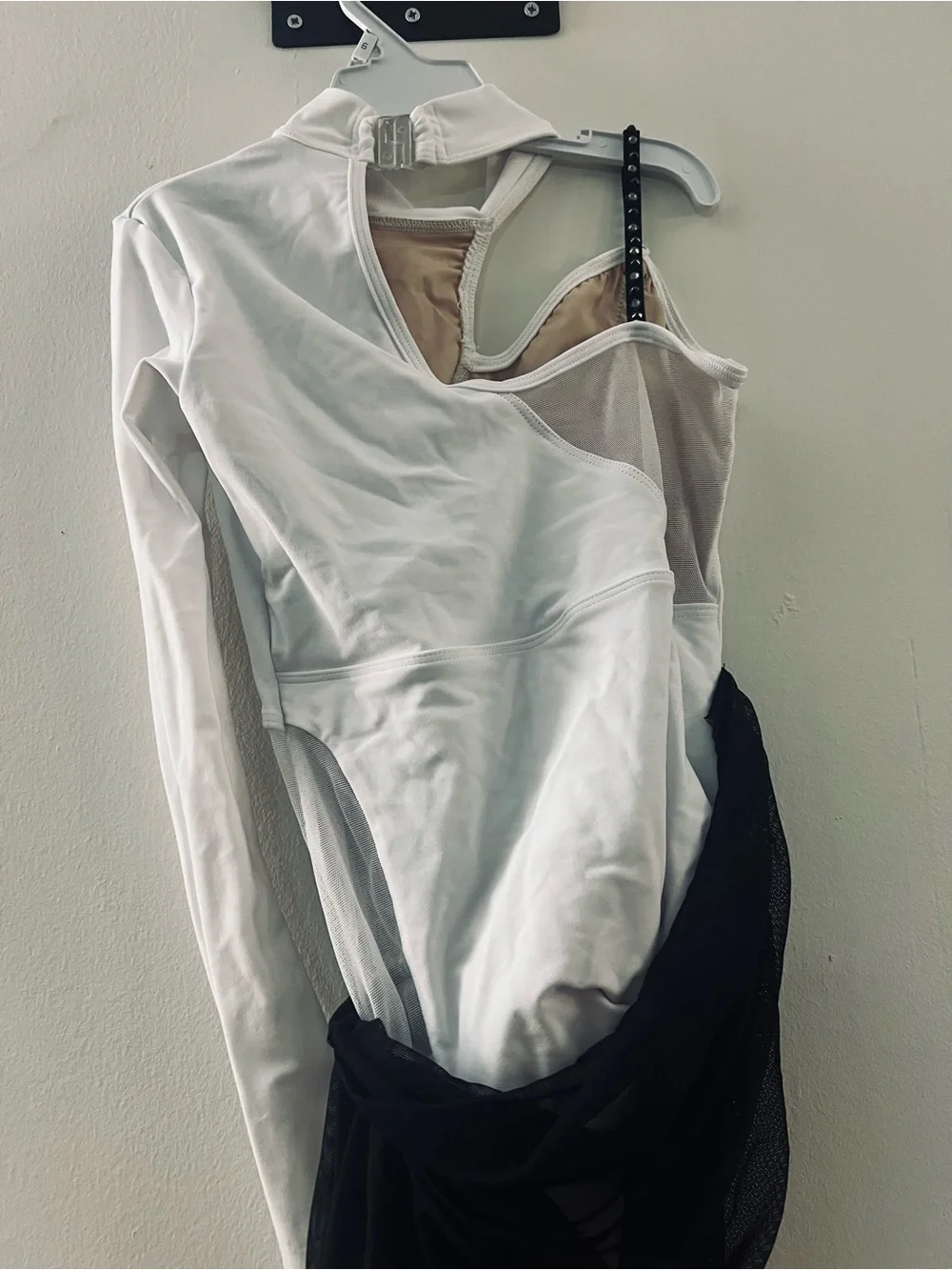 White and Black Asymmetric Dance leotard with Mesh Draping and cap.